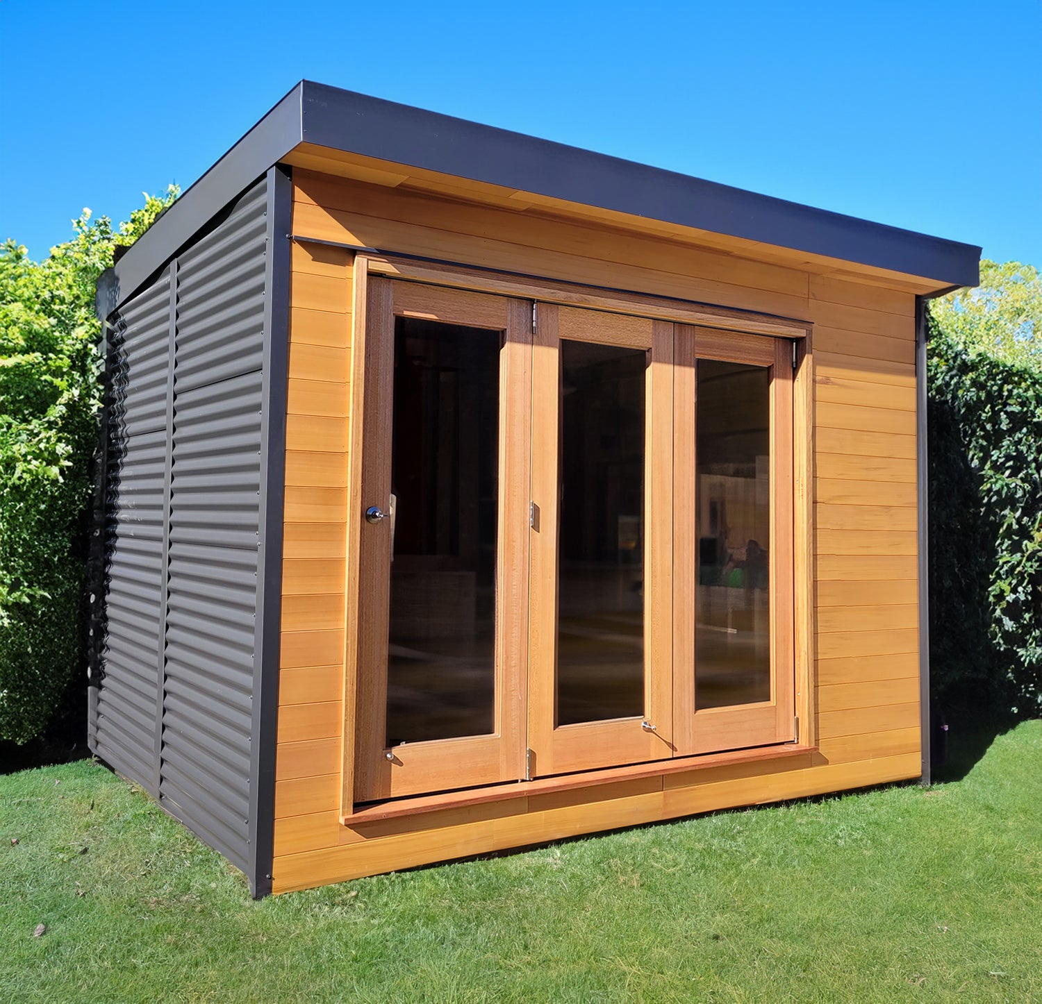 Designer Hideaways Hideout – compact 9.5m² backyard studio with cedar cladding and bifold doors, ideal for home office or creative space.