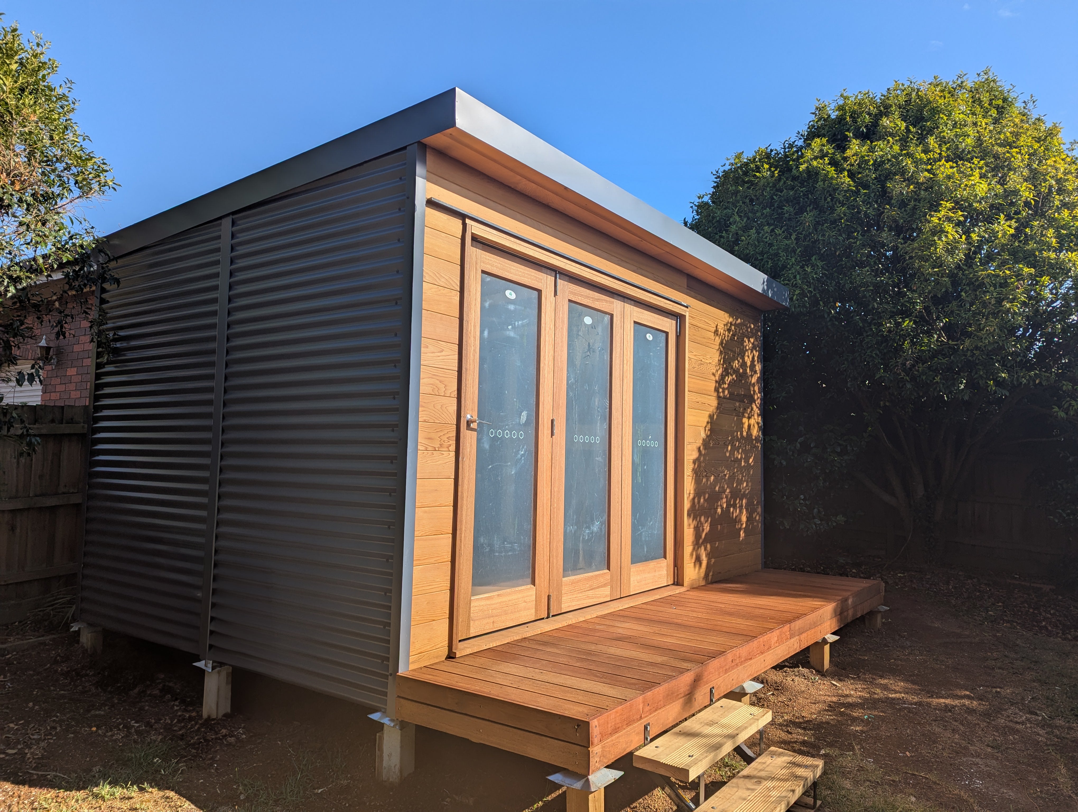 Timber deck extension added to prefab backyard studio — enhances outdoor usability and provides a stylish, functional entrance to the garden room.